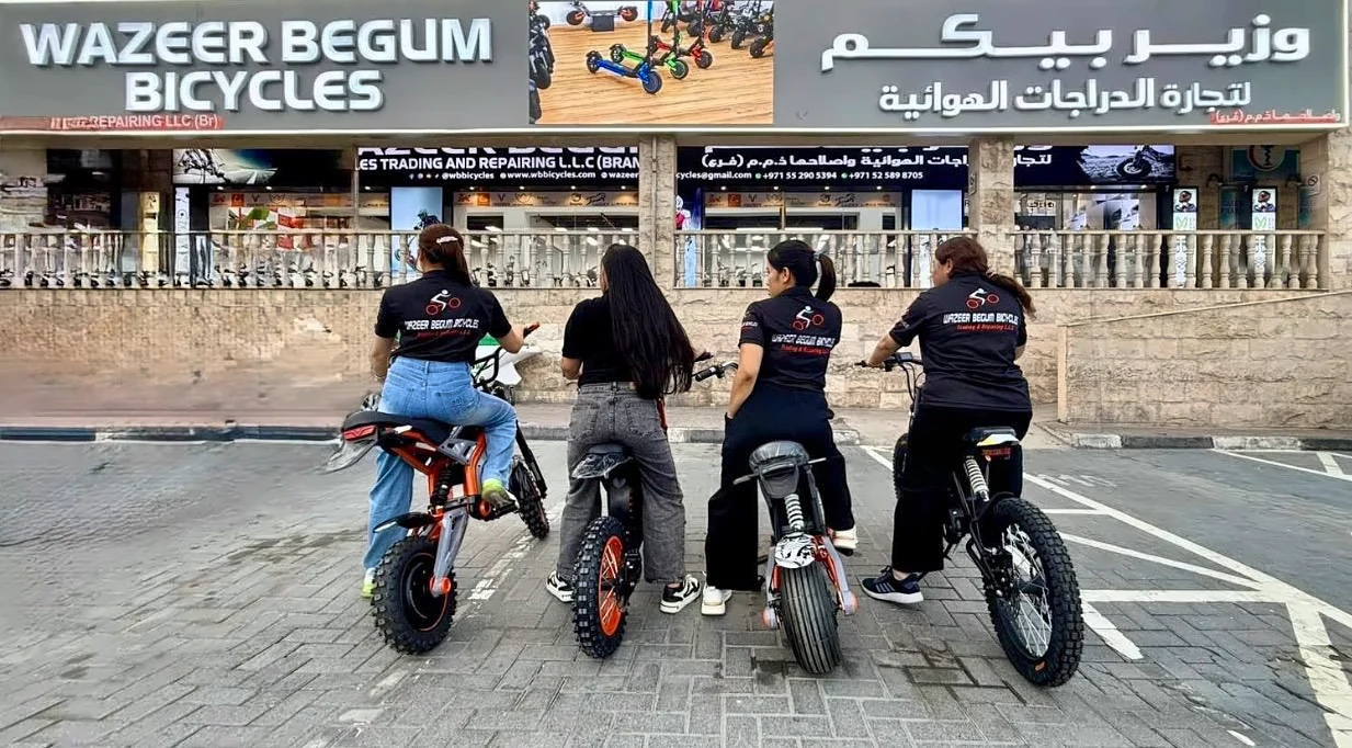 WB Bikes team riding electric bikes outside our Al Quoz Mall shop in Dubai