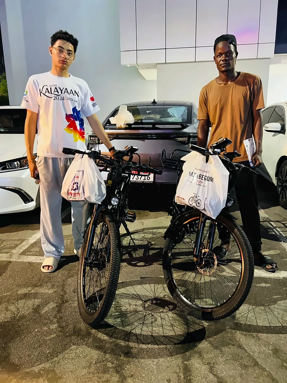 Two customers with their new e-bikes from WB Bikes